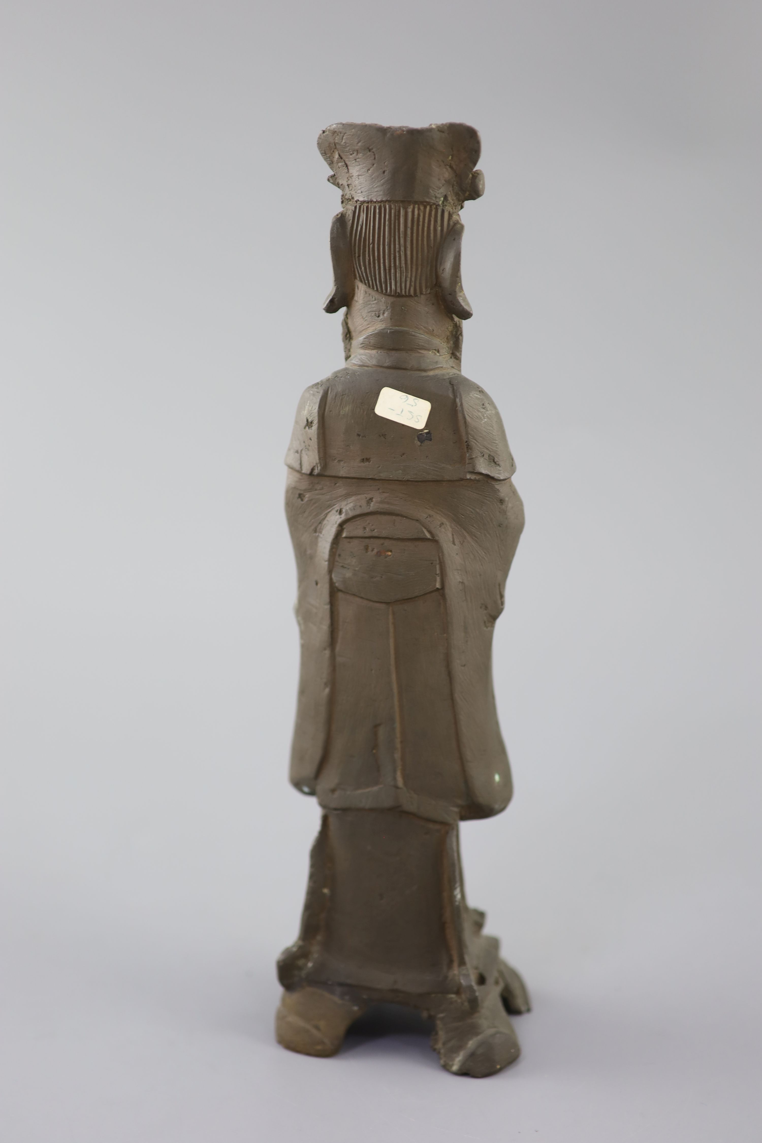 A Chinese bronze standing figure of an Emperor, late Ming dynasty, 30cm high, losses, Provenance - A. T. Arber-Cooke